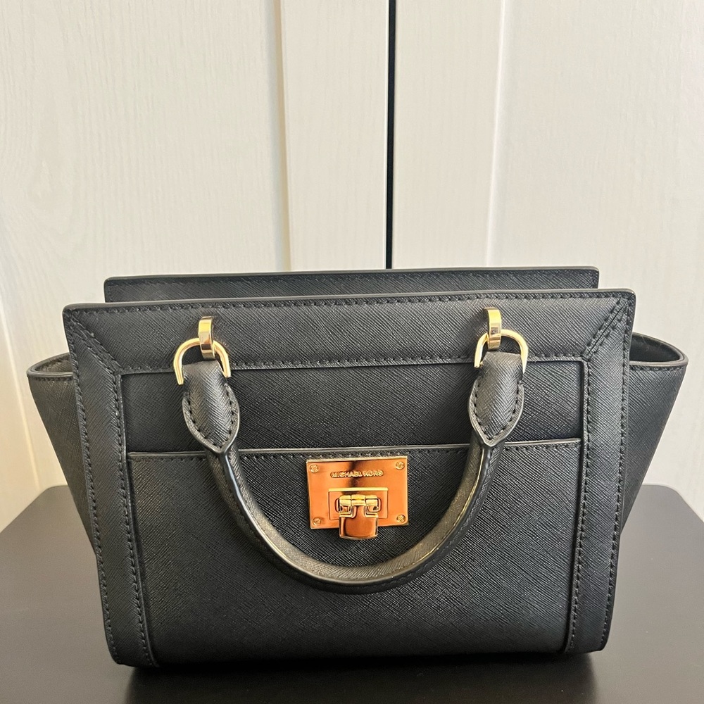 Brand new, never used. Strap in bag. Black and gold Michael Kors Bag. Authentic